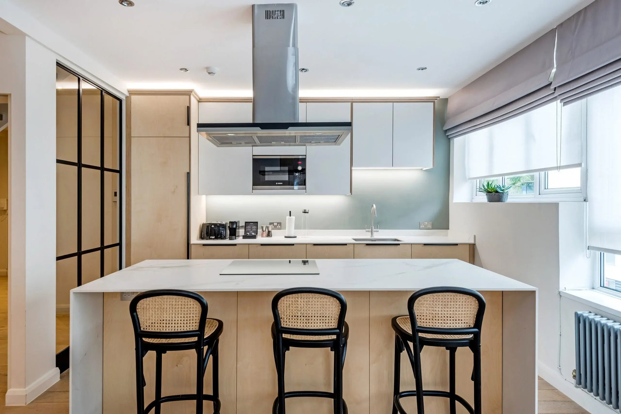 Kitchen with three stools