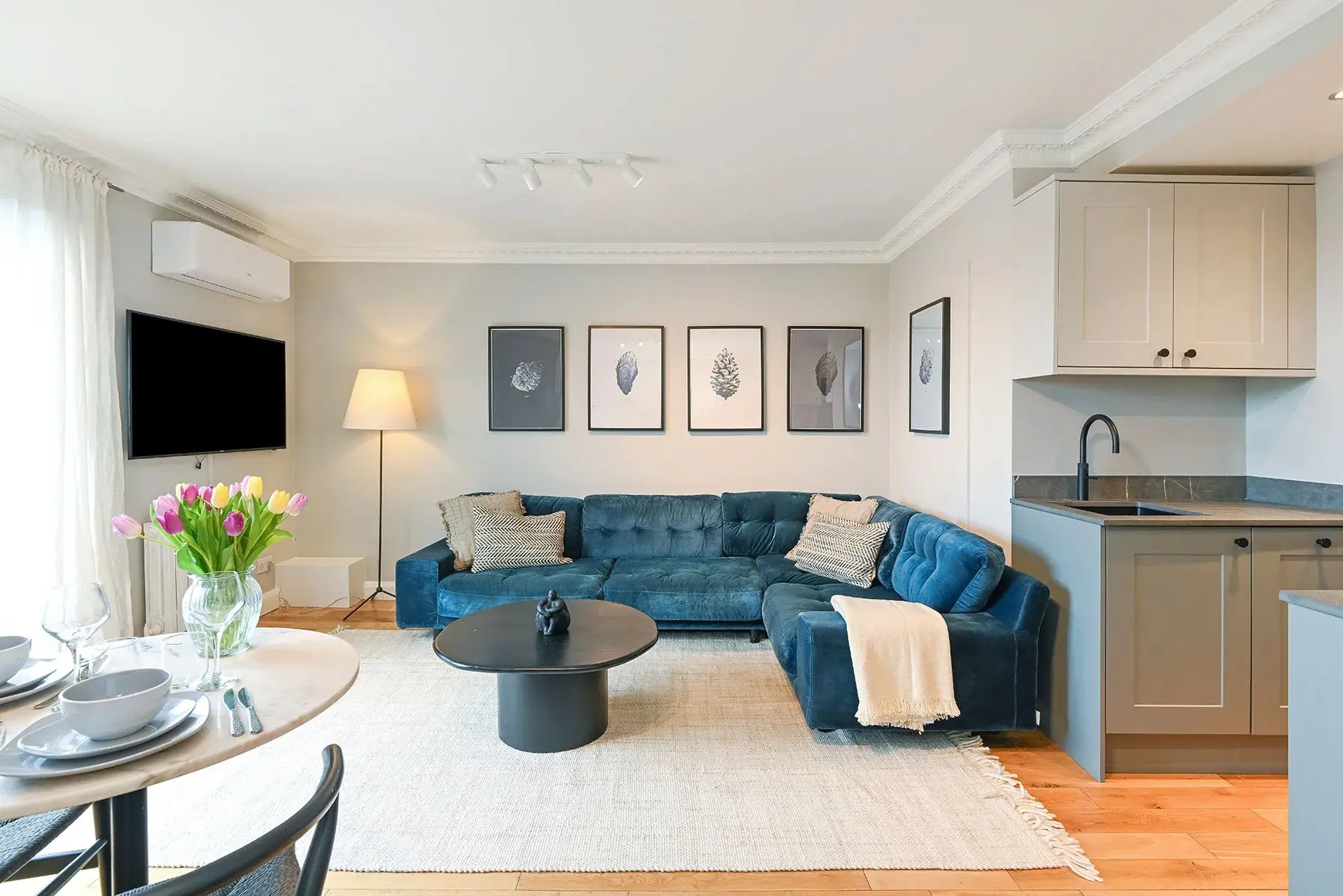 View of the kitchen and the living room at Sherbourne Court, Buckingham and Lloyd
