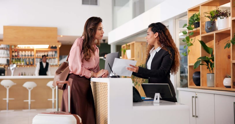 Hotel guest reviewing a bill during their stay
