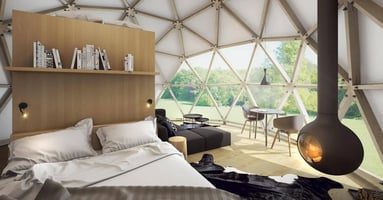 Photo of a beautifully appointed, eco-friendly hotel room with natural light and energy efficient heating. 