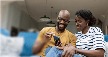 Couple happily booking a hotel room