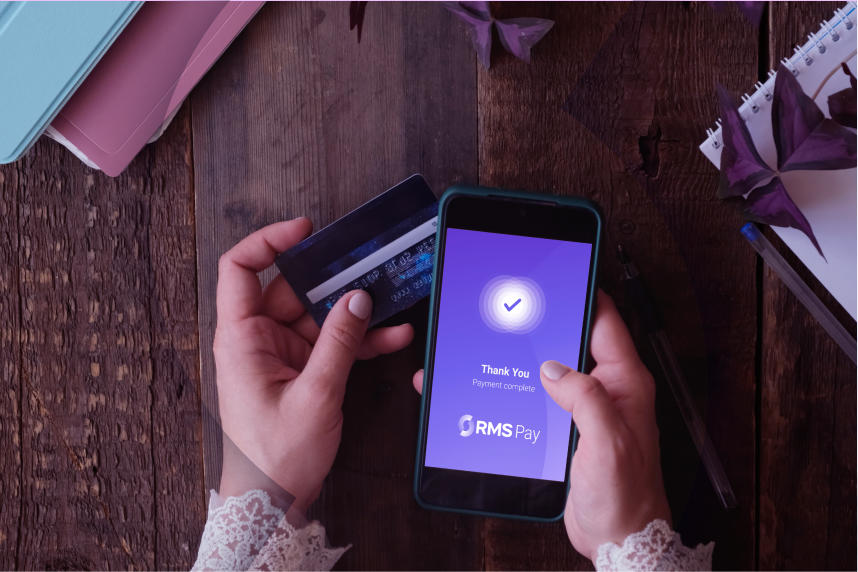 Photo of a guest using RMS Pay to complete her transaction