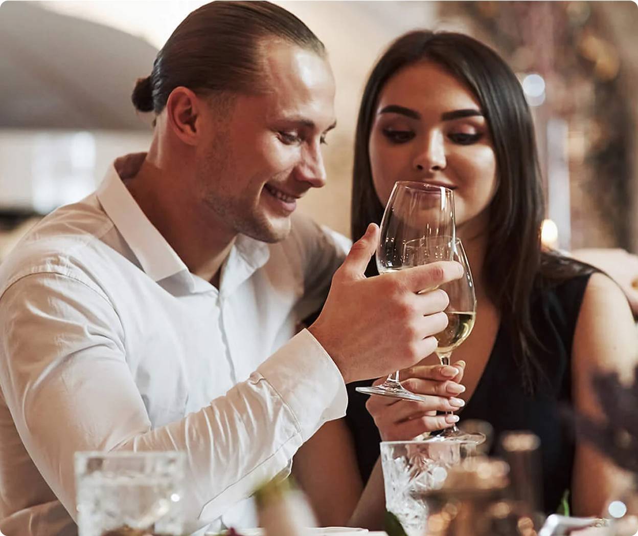 Couple holding wine glasses