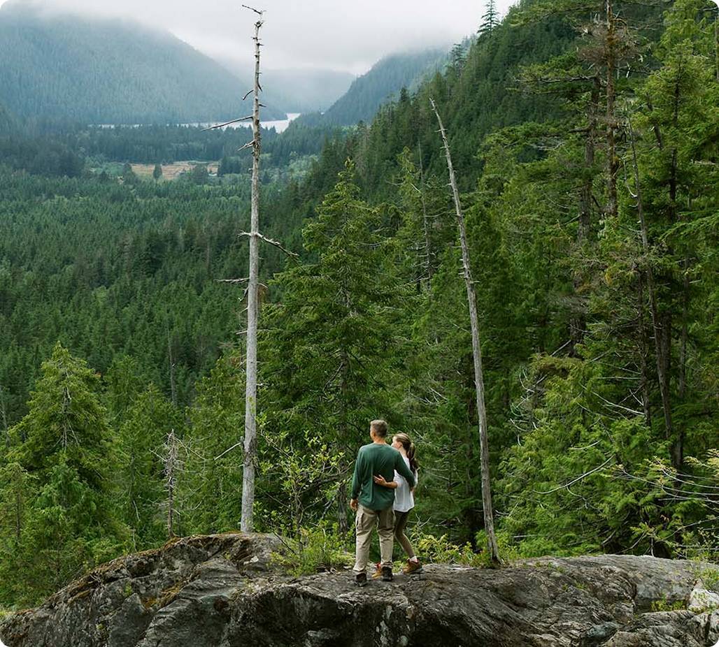 Couple standing in forest