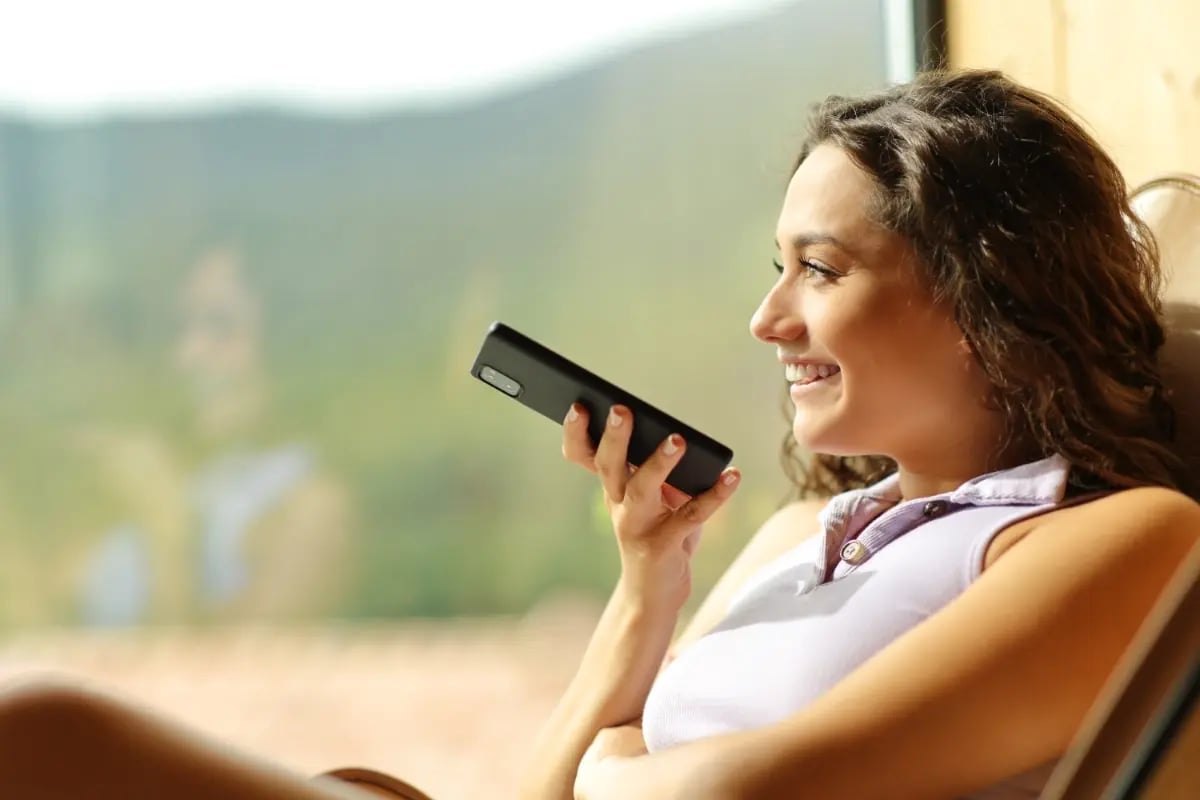 Relaxed young woman conducting a conversational search on her mobile device.