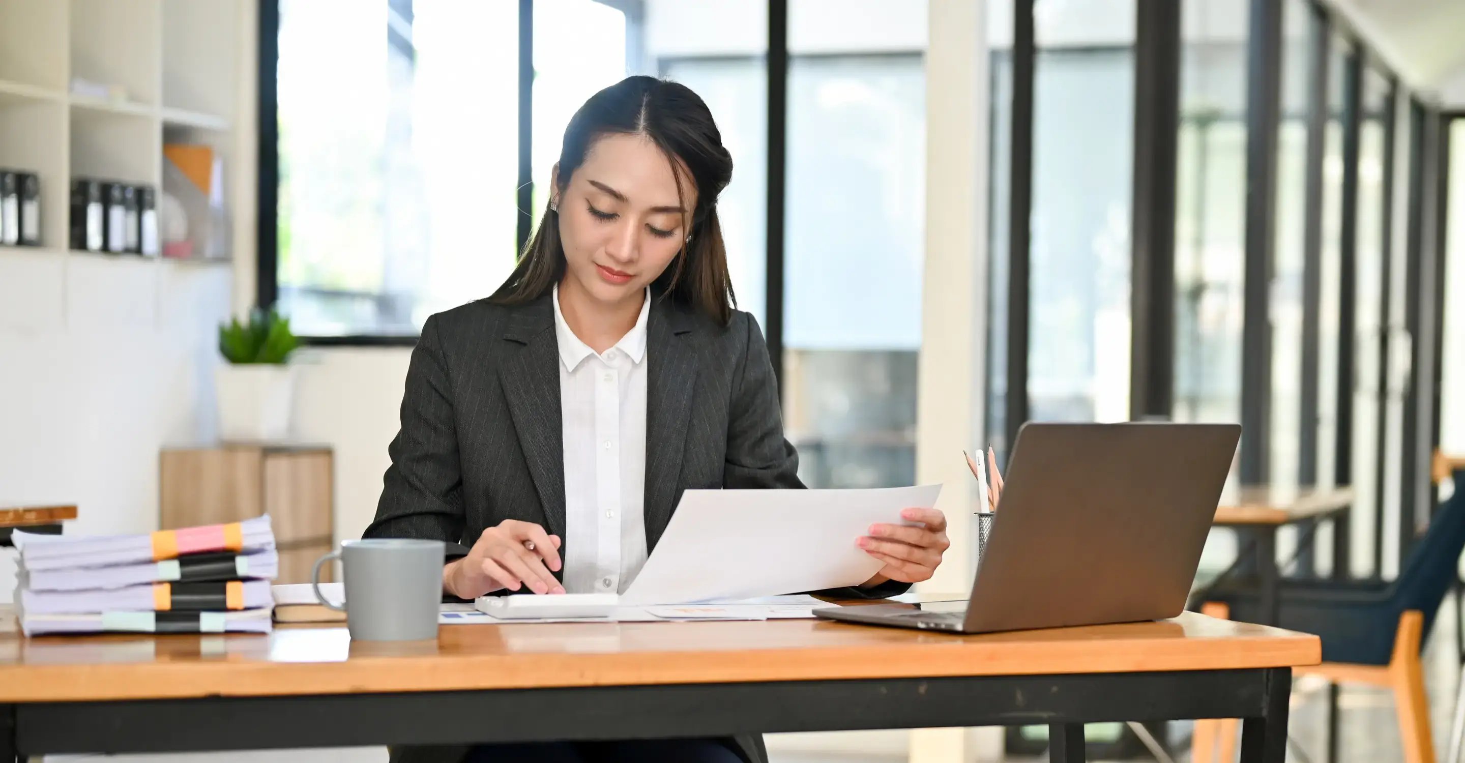 Image of a hotel accountant looking into the budget. 