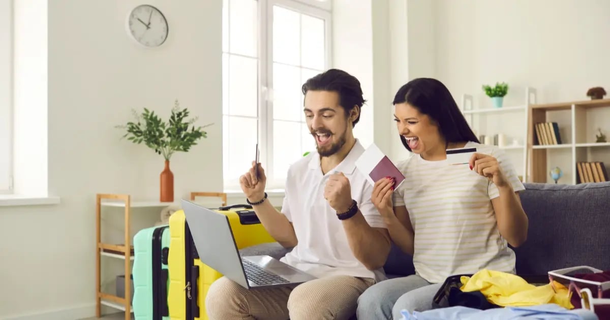 Photo of travelers who are excited that they have got the best price for their hotel booking.