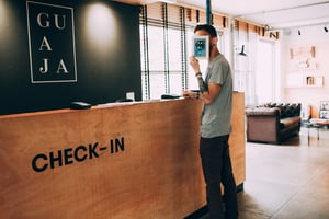 Guest checking in at a hotel reception desk