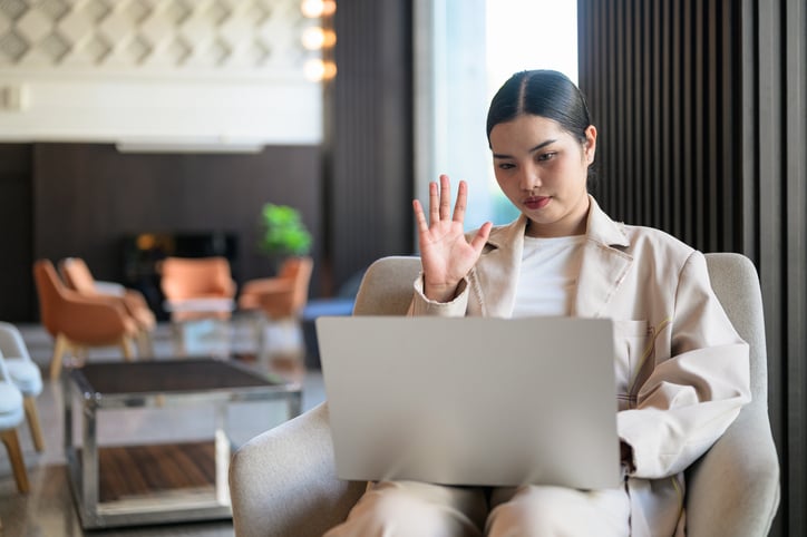 Young woman working in a hotel lobby