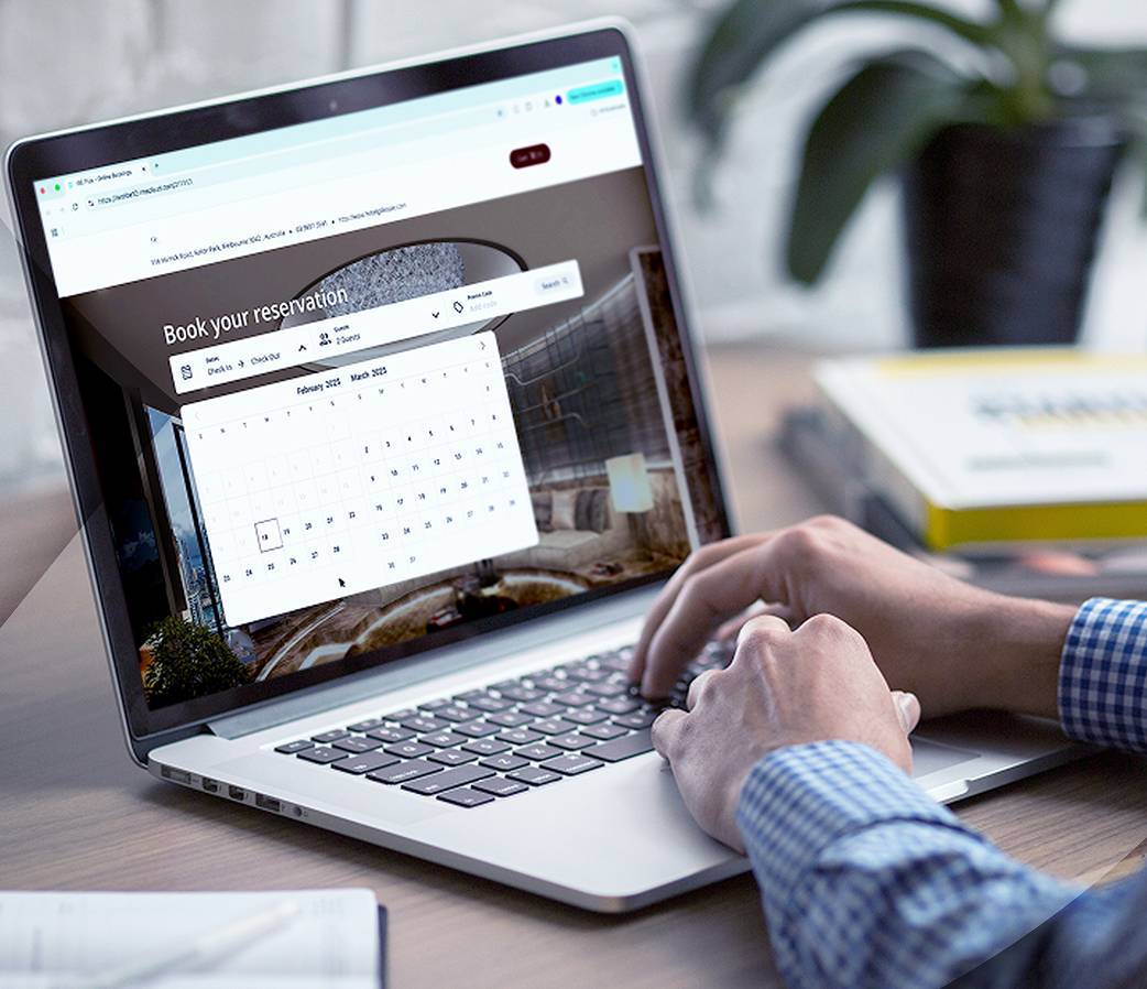 Person using laptop to book a reservation