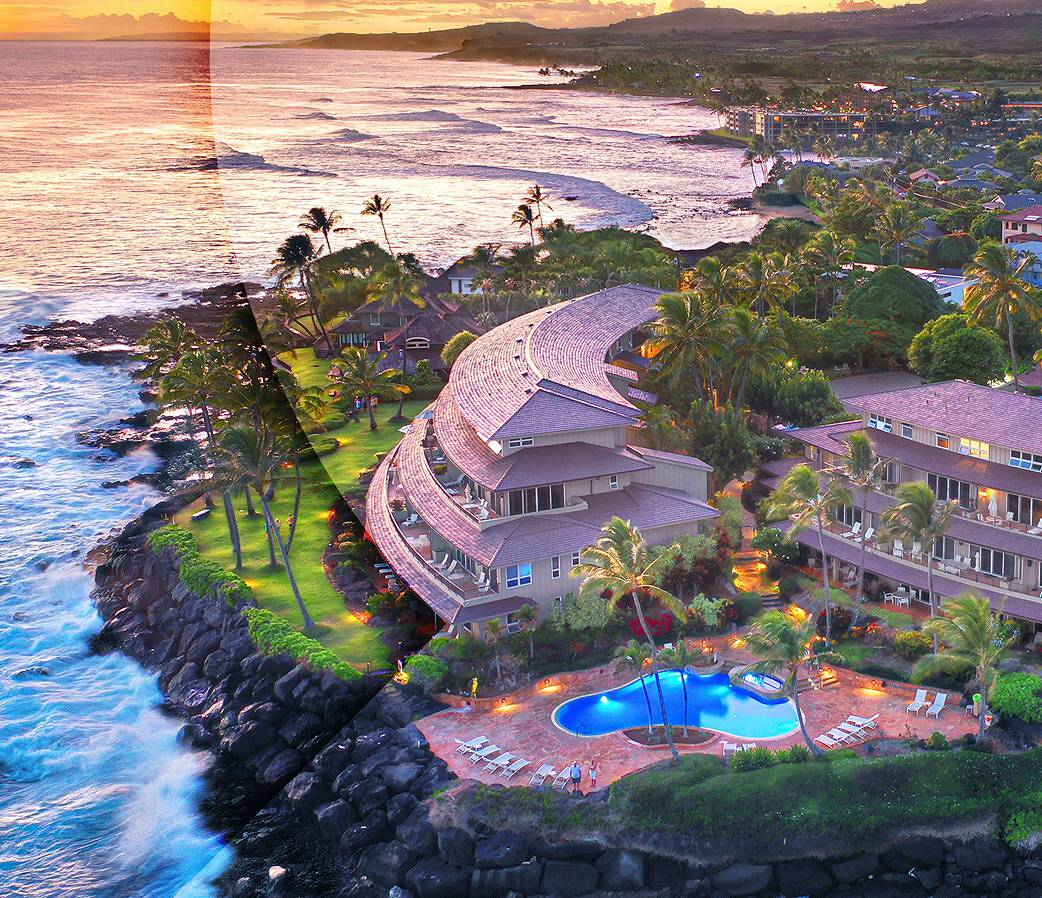 Birds eye view of a resort on coast at sunset