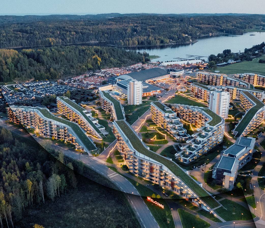 Birds eye view of resort next to lake