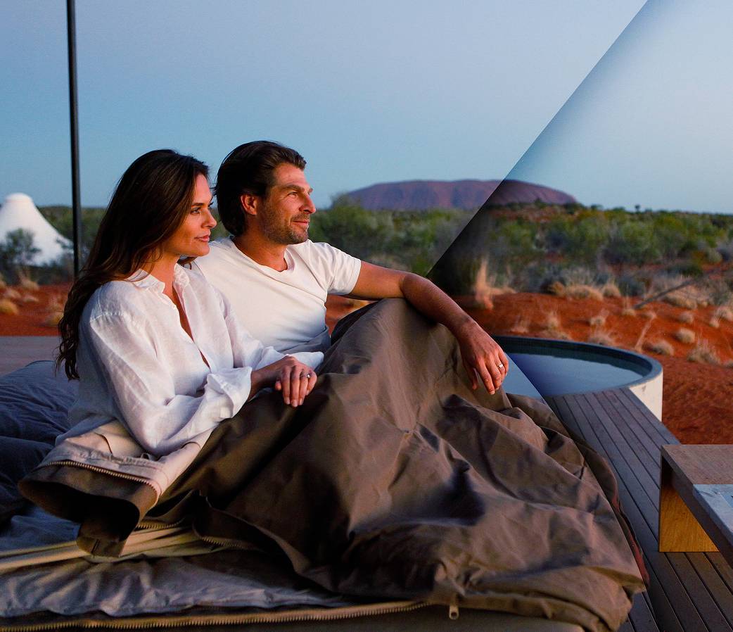 Couple sitting outside with blanket