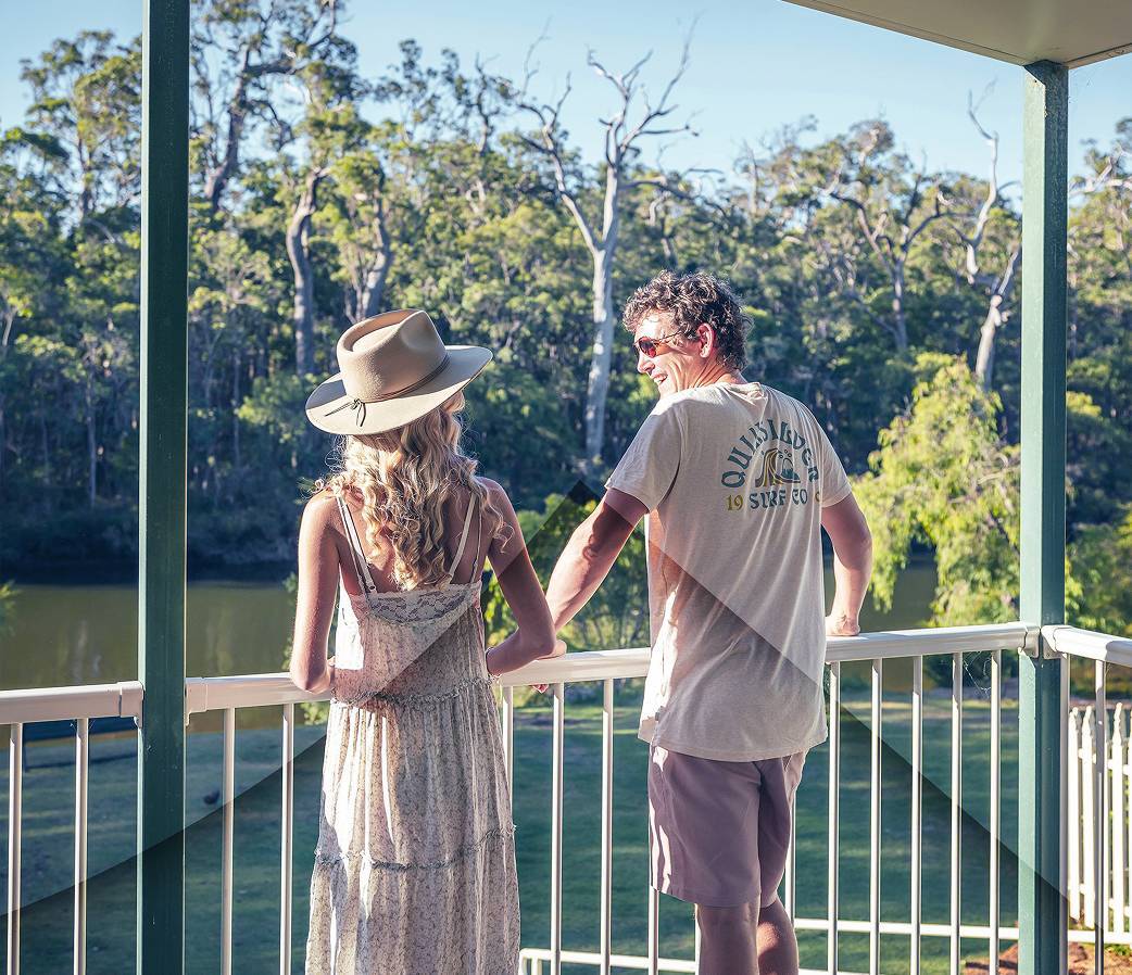 Couple standing on balcony