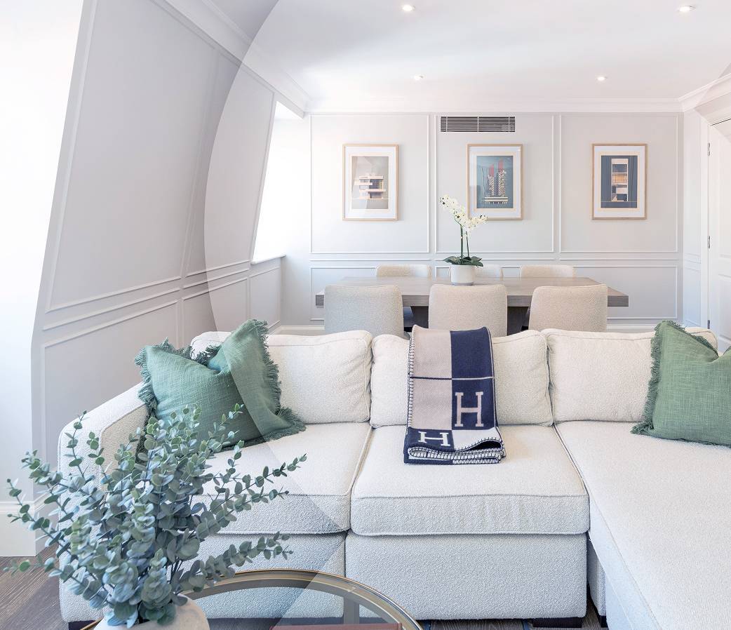 White living space with sofa and dining table