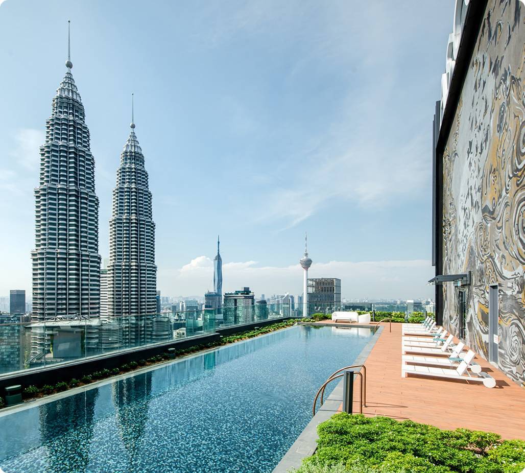 Outdoor pool area opposite high rise buldings