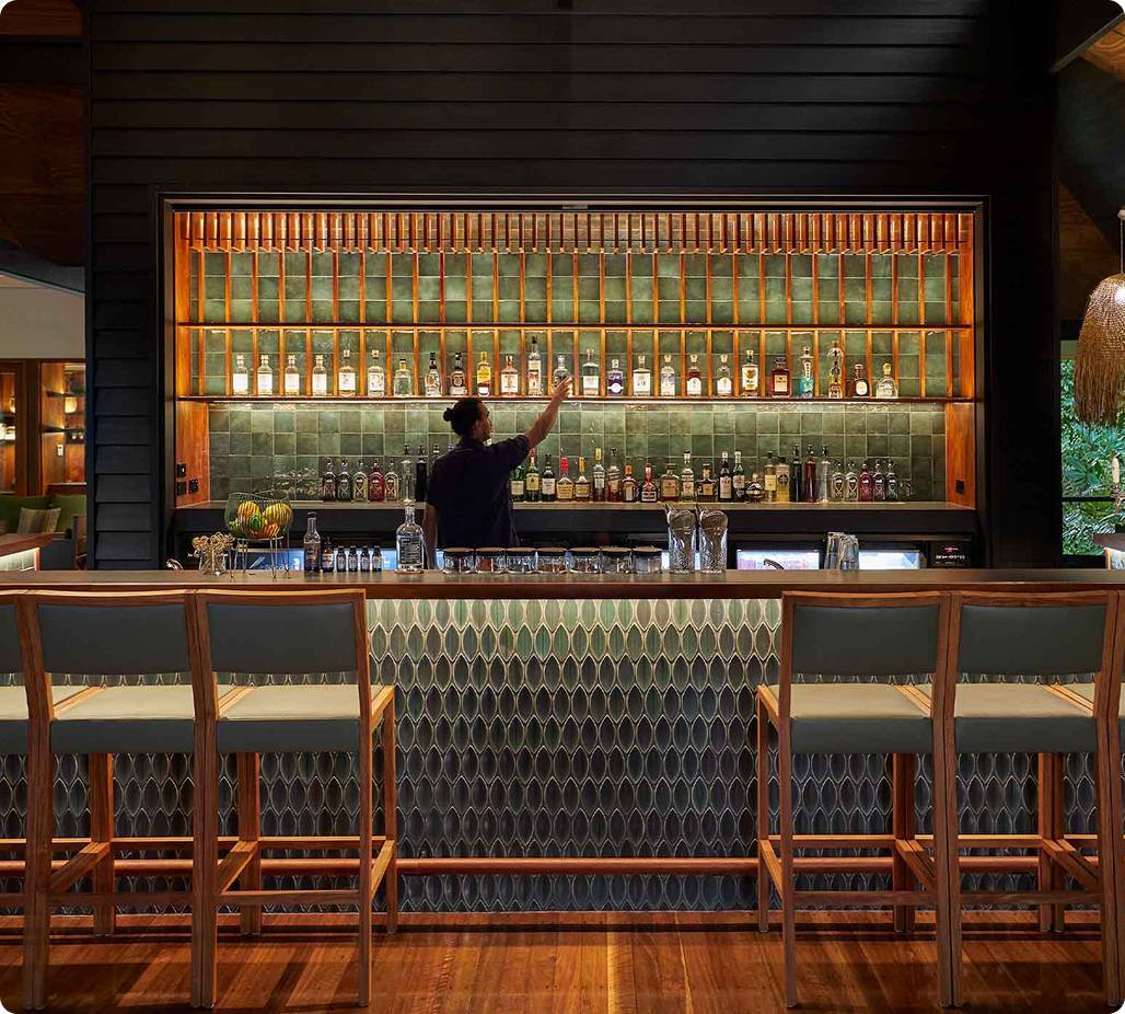 Bartender placing drinks on shelf