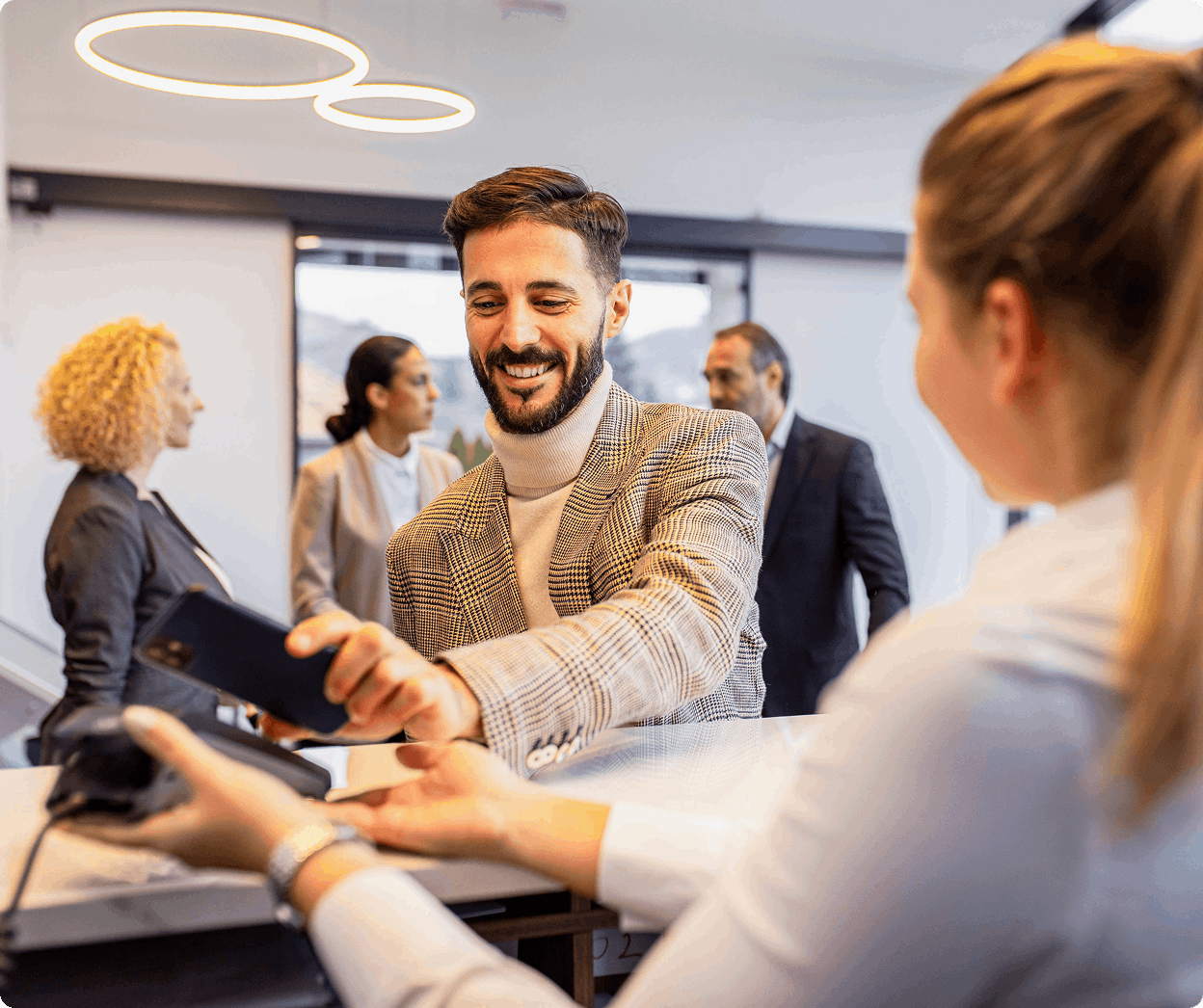 Man paying at reception