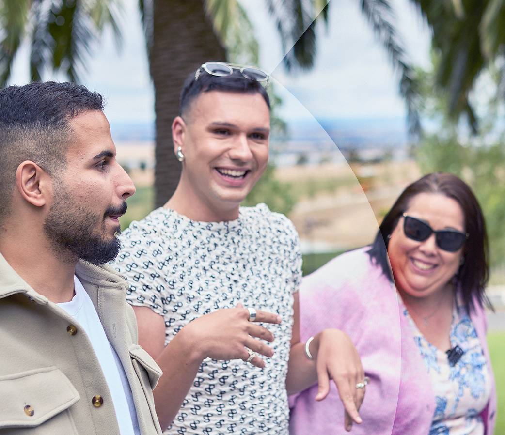 Three people at beach resort