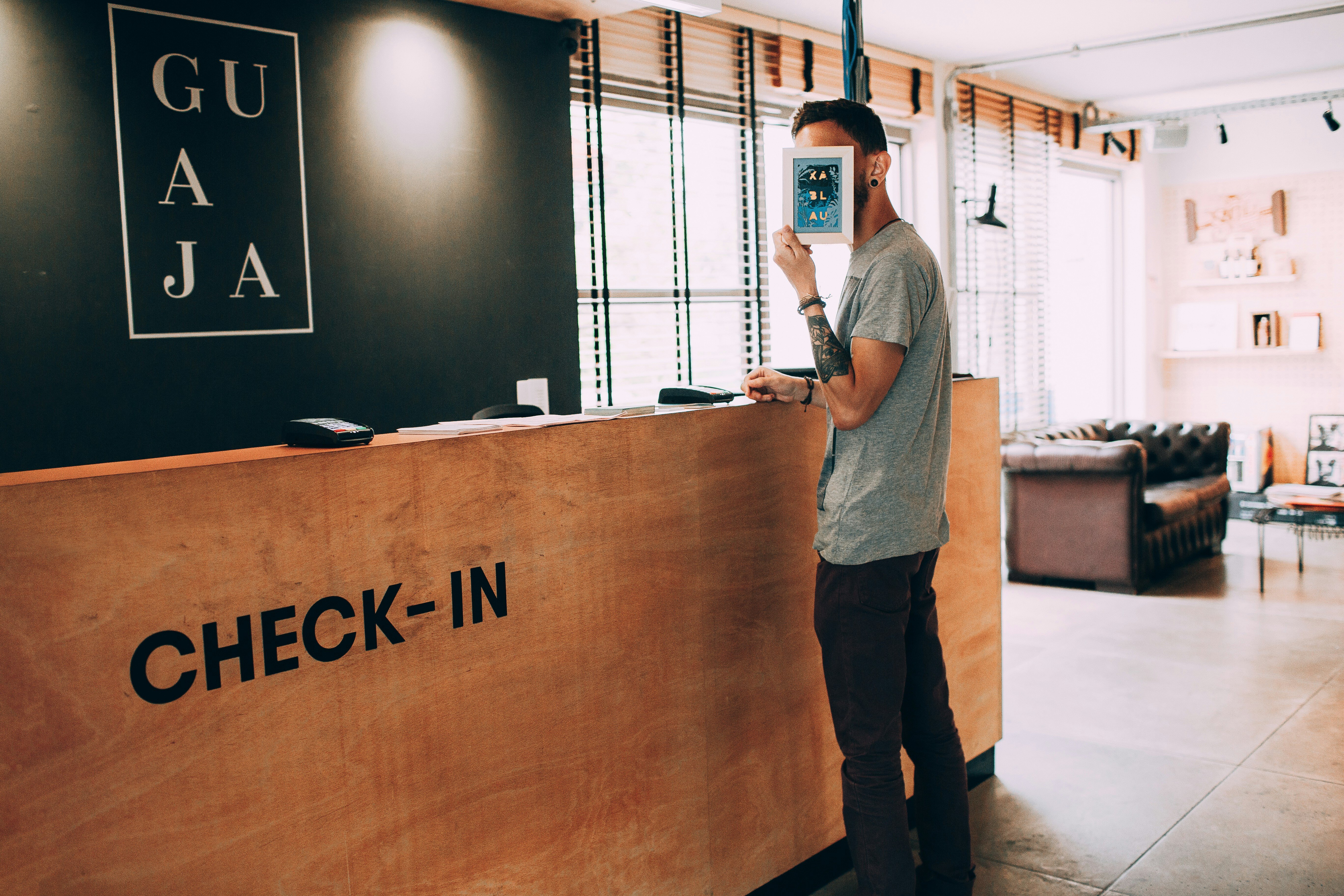Guest checking in at a hotel reception desk