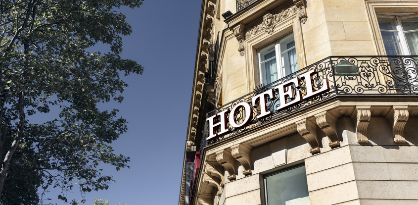 Hotel sign on building facade in Paris
